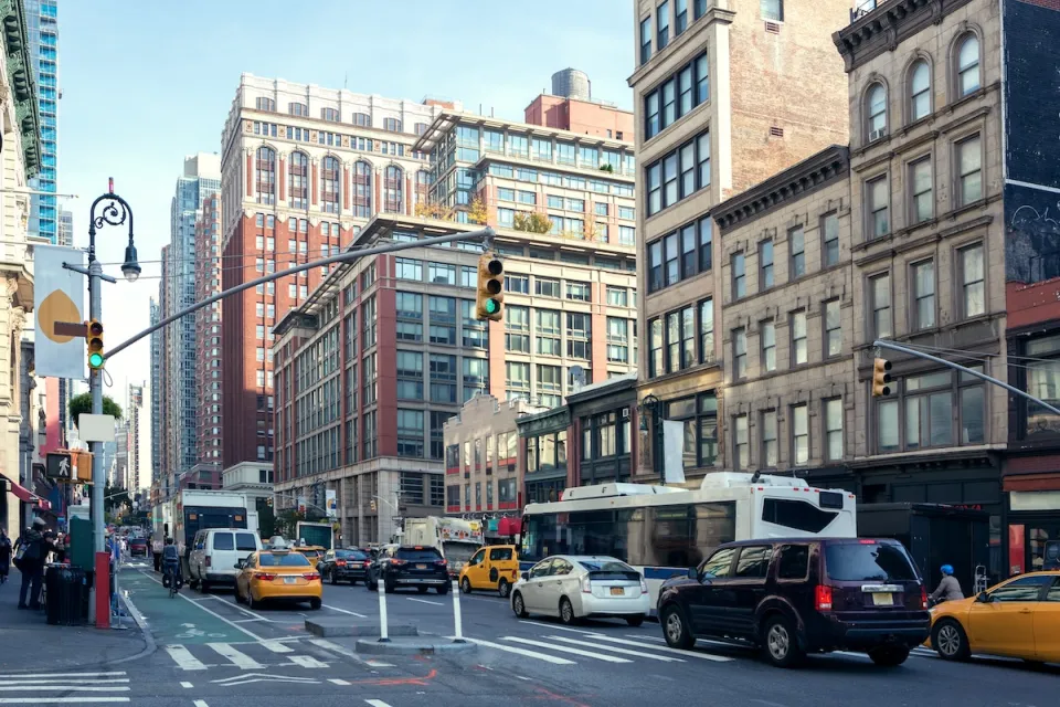 Traffic and old buildings in Manhattan, New York City.